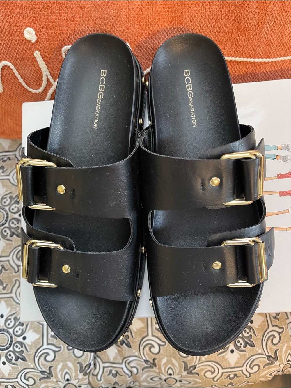 BCBGeneration Black Slide Sandals with Gold Buckles